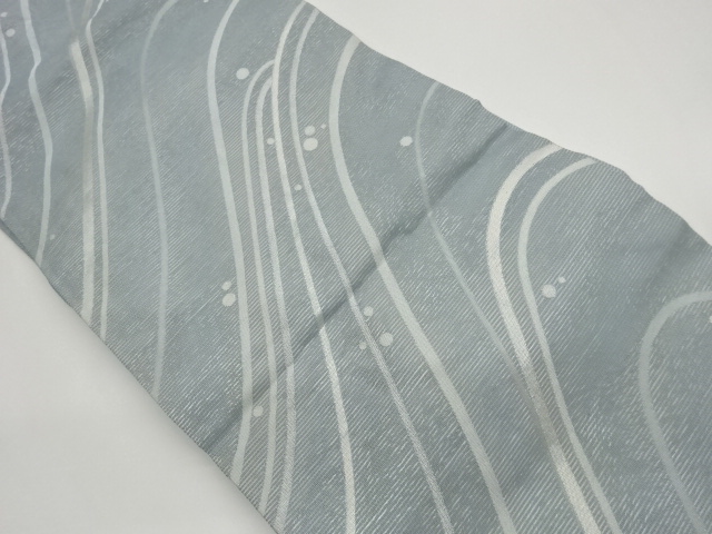 Nagoya obi with a circular pattern woven into a gauze curve